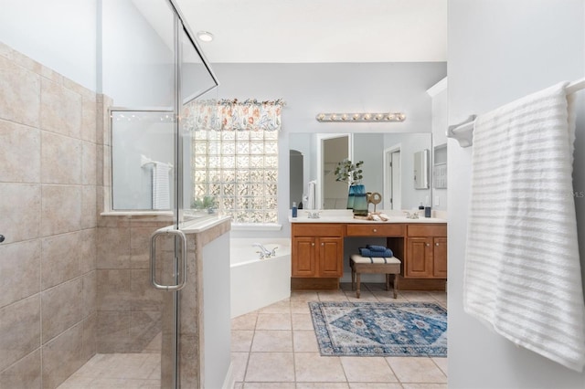 bathroom with vanity, shower with separate bathtub, and tile patterned flooring