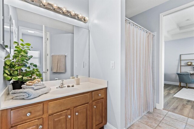 bathroom with vanity and hardwood / wood-style flooring