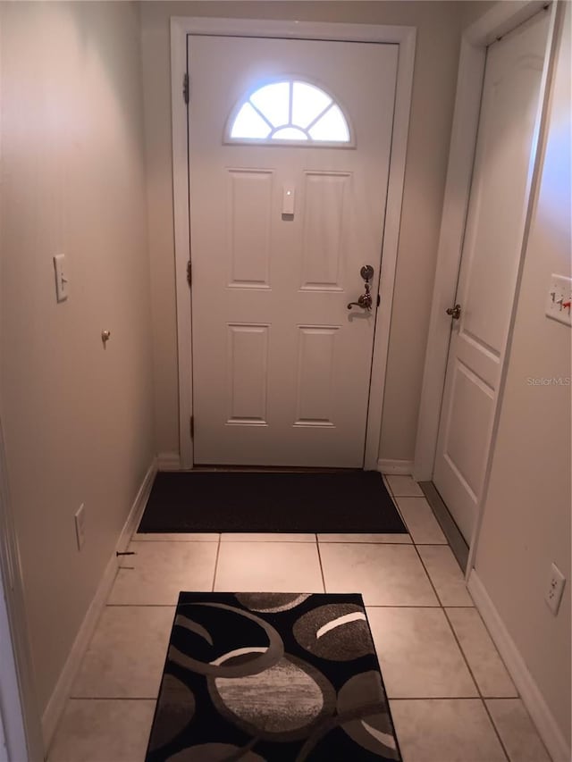 entryway featuring light tile patterned floors