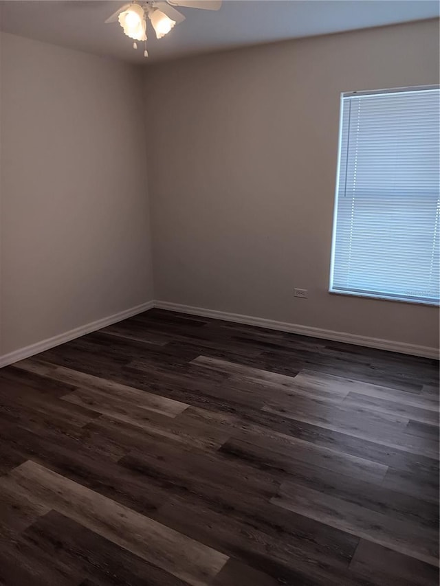 unfurnished room featuring ceiling fan and dark hardwood / wood-style floors