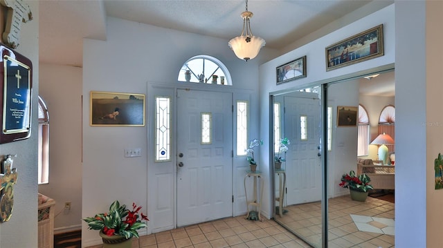 entryway featuring light tile patterned floors