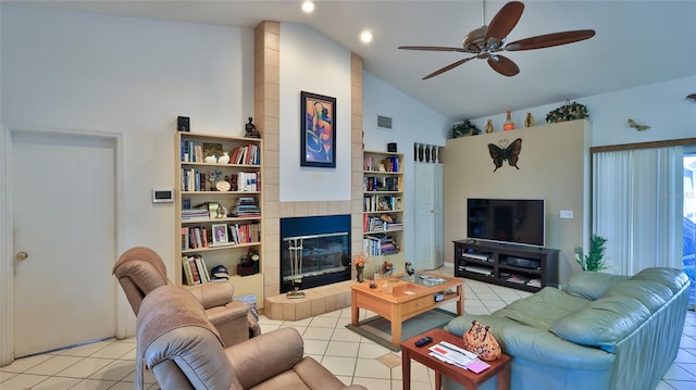 living room with ceiling fan, a fireplace, light tile patterned flooring, and high vaulted ceiling