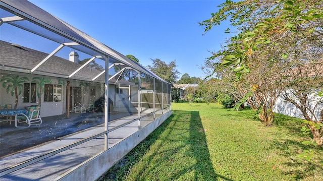 view of yard with a patio and a lanai