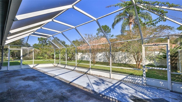 view of patio with glass enclosure