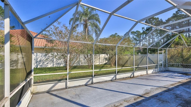 unfurnished sunroom featuring a pool