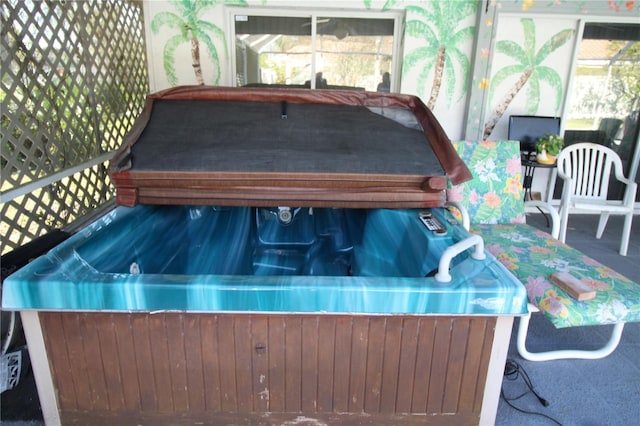 exterior space with a covered hot tub