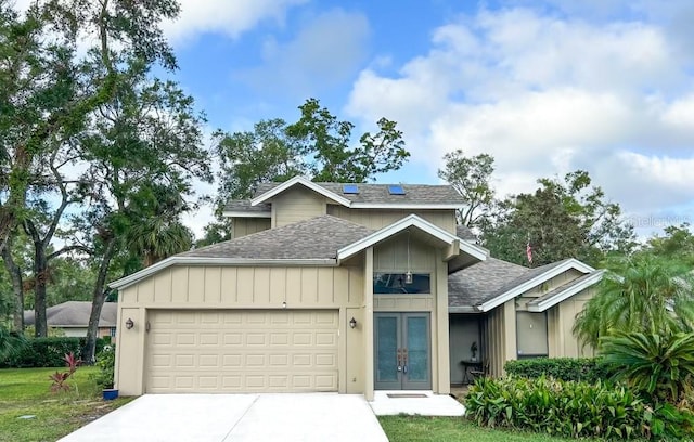 view of front facade featuring a garage and french doors