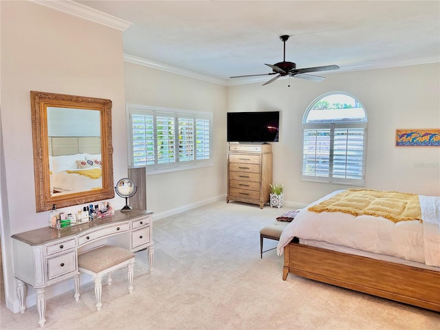 carpeted bedroom featuring ceiling fan, ornamental molding, and multiple windows