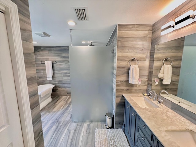 bathroom with plus walk in shower, vanity, and tile walls