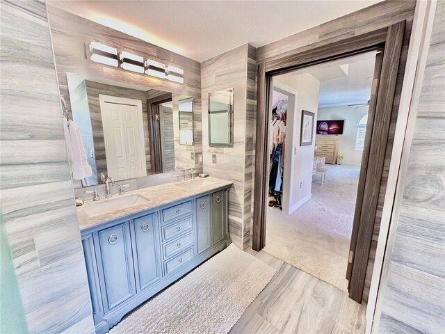 bathroom with vanity and ceiling fan