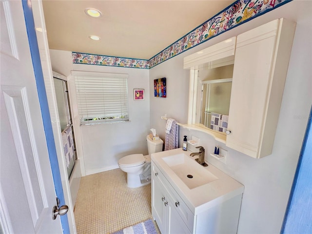 full bathroom featuring tile patterned floors, vanity, toilet, and combined bath / shower with glass door