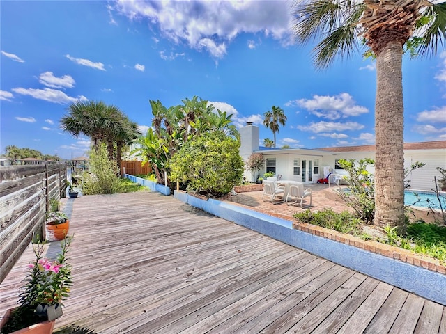 wooden deck featuring a patio area