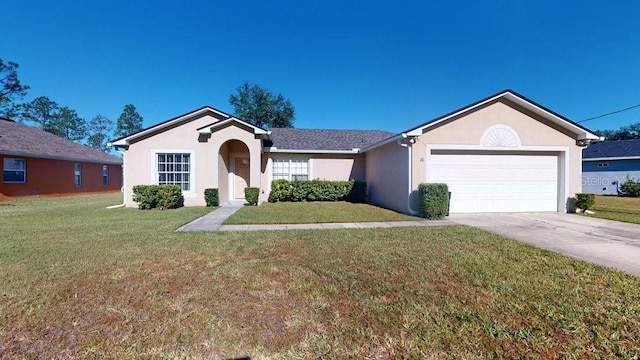 ranch-style home featuring a garage and a front lawn