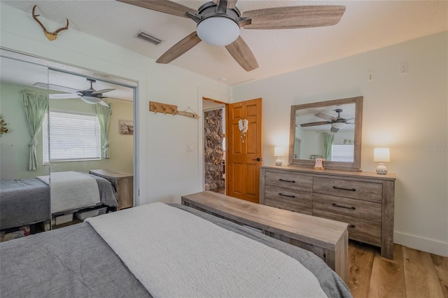 bedroom featuring light hardwood / wood-style floors and ceiling fan