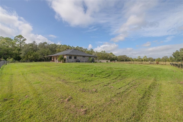 view of yard with a rural view