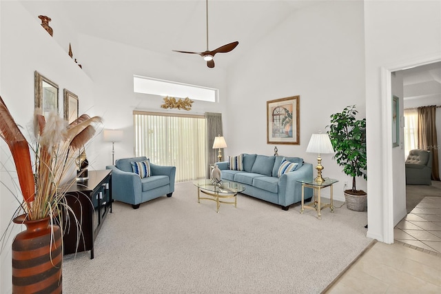 tiled living room featuring high vaulted ceiling and ceiling fan