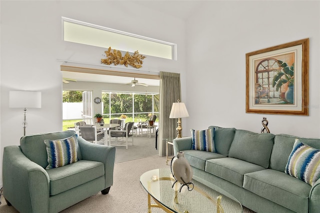 living room featuring ceiling fan and carpet floors