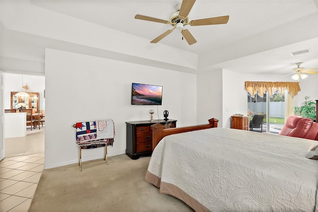 carpeted bedroom with ceiling fan and access to exterior