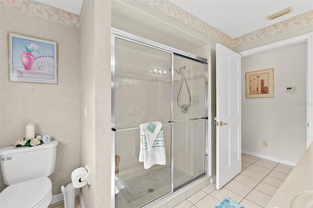 bathroom with walk in shower, toilet, and tile patterned floors