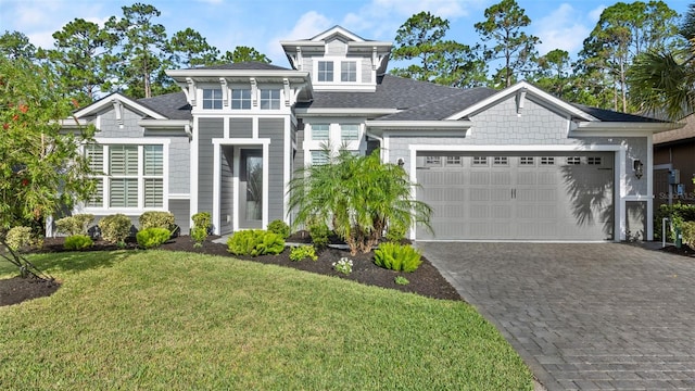 view of front facade featuring a garage and a front lawn