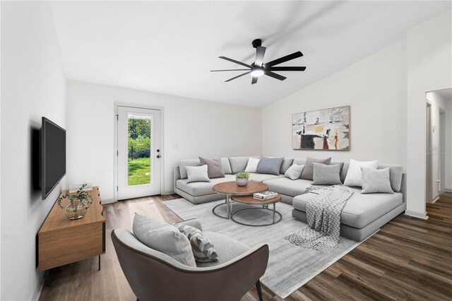 living room featuring ceiling fan, vaulted ceiling, and wood finished floors