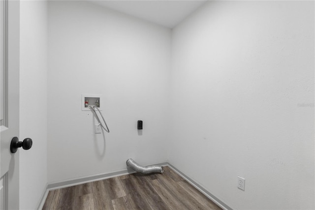 washroom featuring laundry area, dark wood-style flooring, hookup for a washing machine, and baseboards