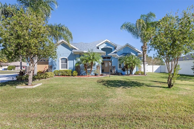 view of front of home with a garage and a front yard