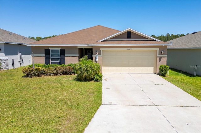 ranch-style home with a garage and a front lawn