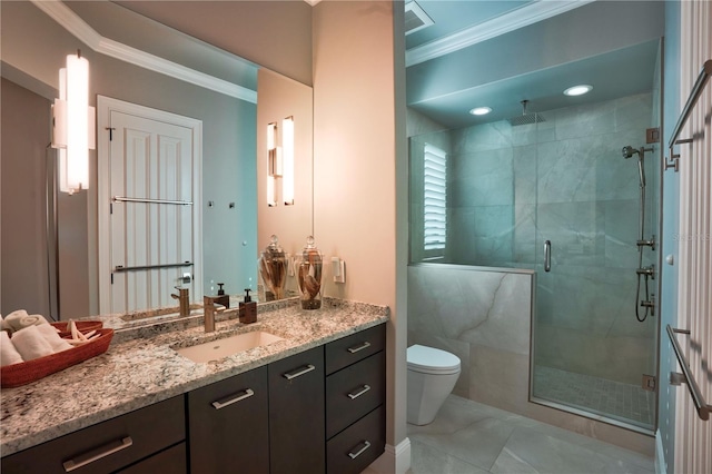 bathroom featuring vanity, toilet, a shower with door, and ornamental molding