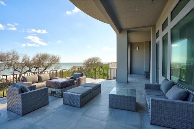 view of patio featuring a water view and an outdoor hangout area