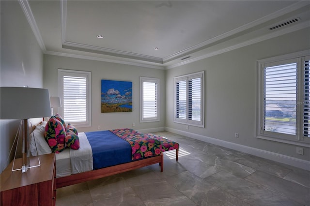 bedroom featuring a raised ceiling and crown molding