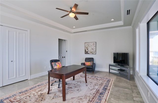 office with ceiling fan, ornamental molding, and a tray ceiling