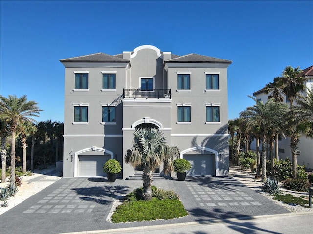 view of front of house with a balcony and a garage