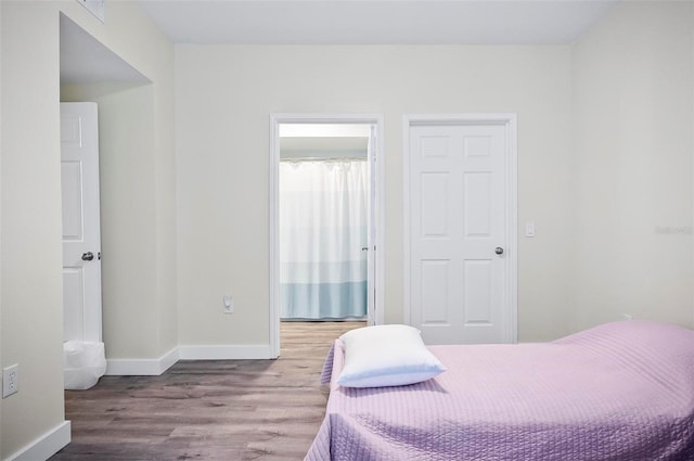 bedroom featuring wood-type flooring