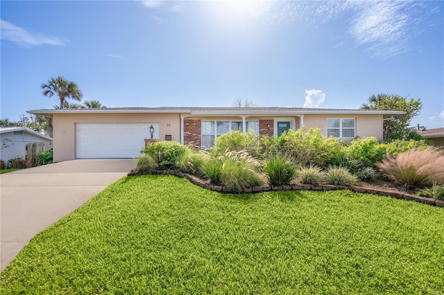 ranch-style home with a garage and a front lawn