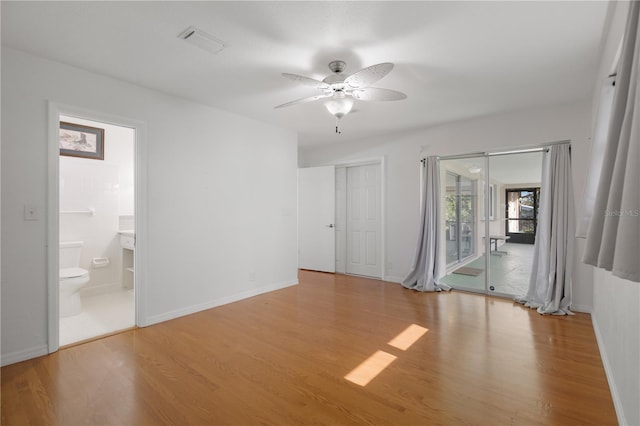 unfurnished room with light wood-type flooring and ceiling fan