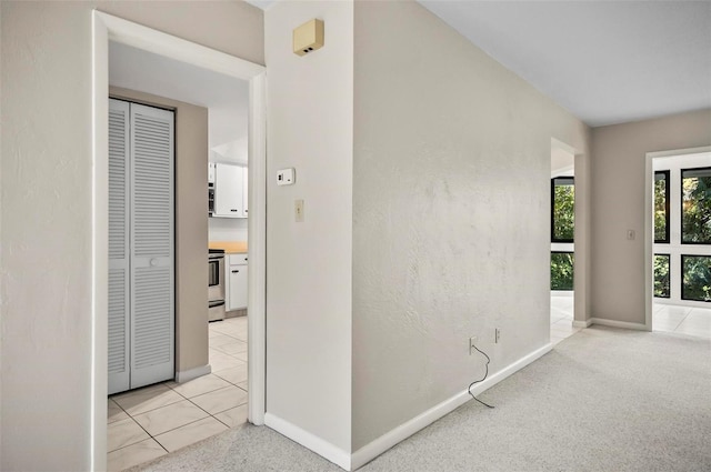 corridor with light colored carpet