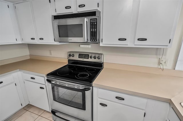 kitchen with white cabinetry and stainless steel appliances