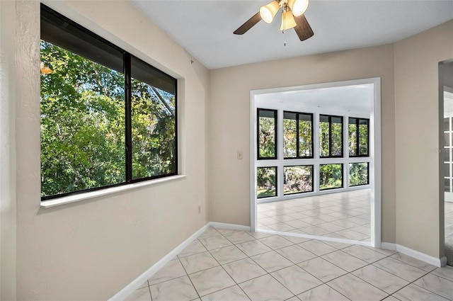 18 Broadmore Cir Unit 18, Palm Coast, FL 32137 - unfurnished room with healthy amount of natural light, ceiling fan, and light tile patterned floors