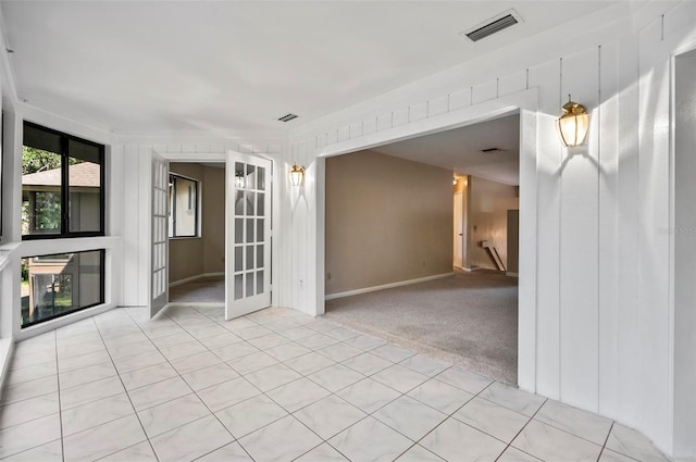 empty room with light colored carpet