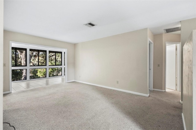 empty room featuring light carpet