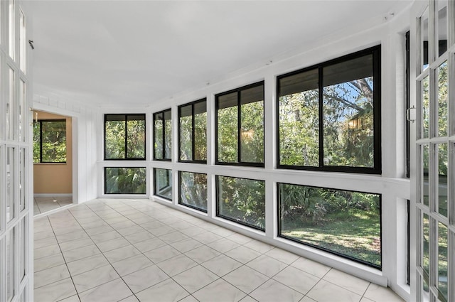 unfurnished sunroom featuring plenty of natural light