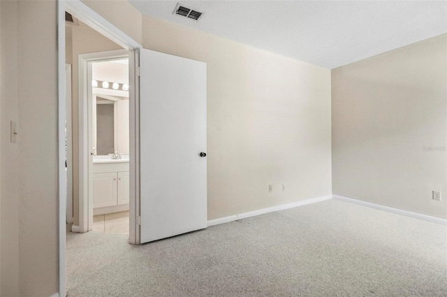18 Broadmore Cir Unit 18, Palm Coast, FL 32137 - spare room featuring carpet floors and baseboards