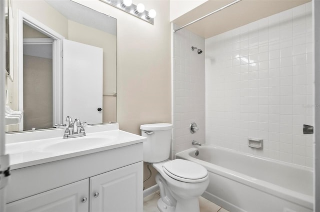 full bathroom featuring tile patterned flooring, vanity, tiled shower / bath combo, and toilet