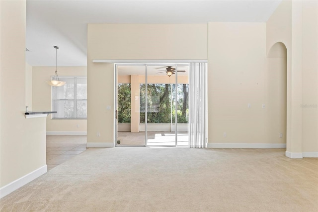 carpeted empty room with ceiling fan