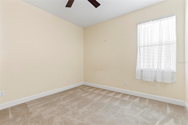 carpeted empty room with ceiling fan