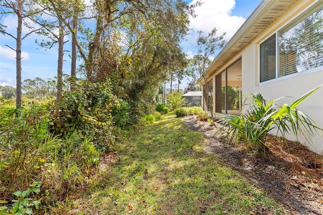 view of yard featuring a sunroom