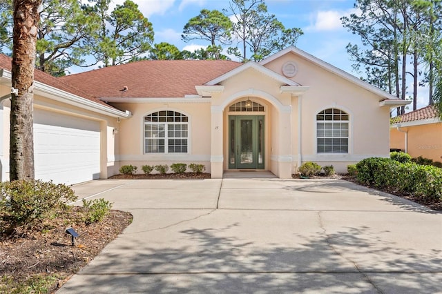 single story home with a garage