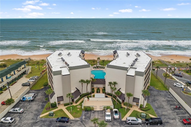 aerial view with a water view and a view of the beach