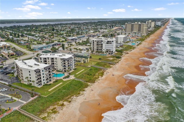 bird's eye view featuring a water view and a view of the beach